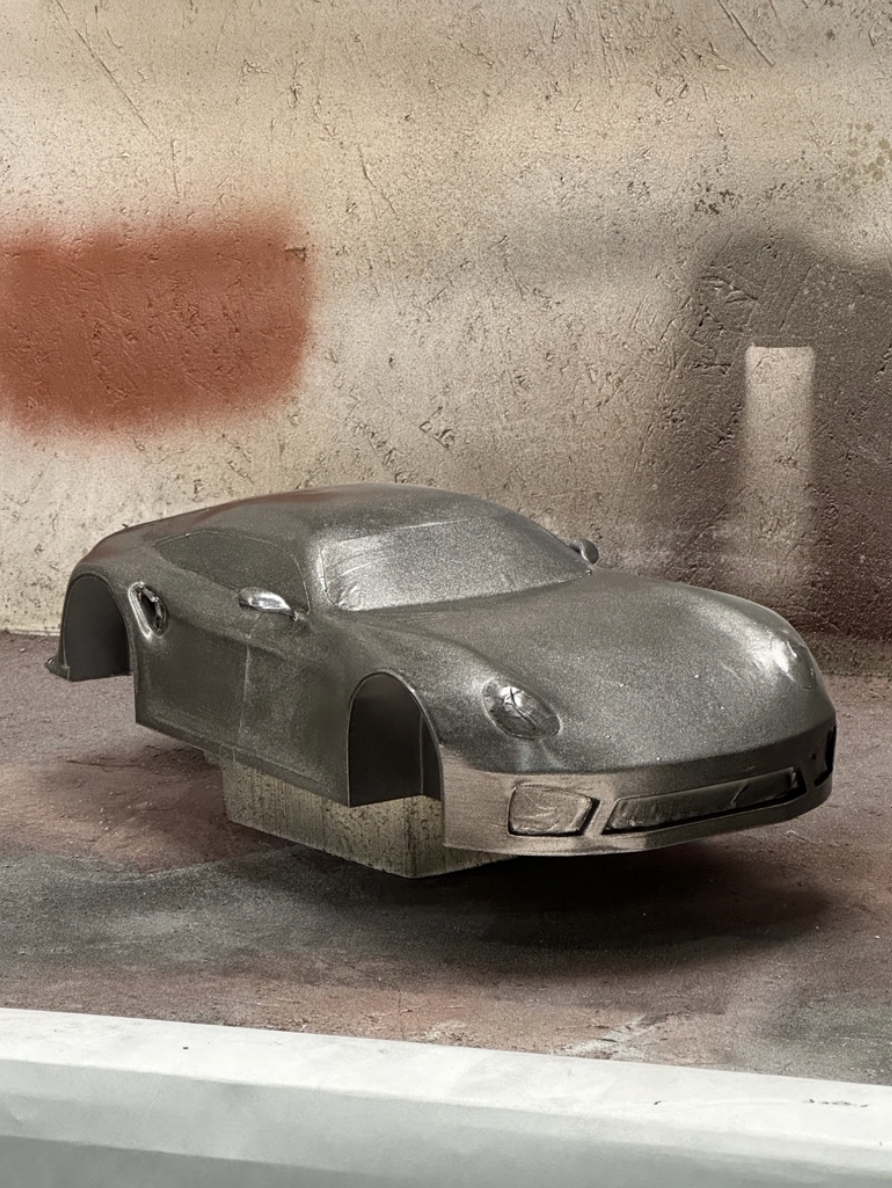 Front three-quarter view of the Porsche GT body during paint finishing