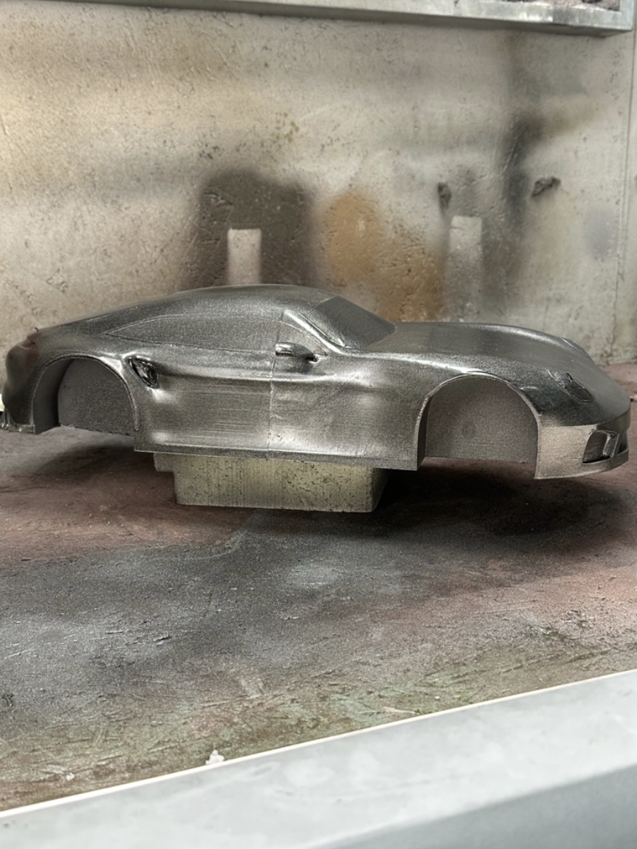 Side view of the Porsche GT body during paint finishing